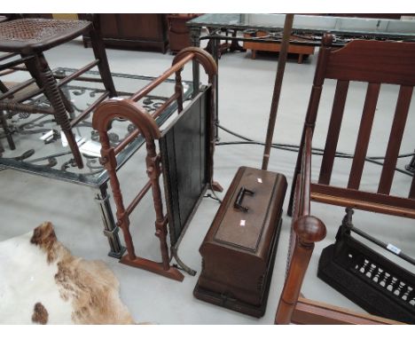 A vintage posser, sewing machine, fire screen and towel rail