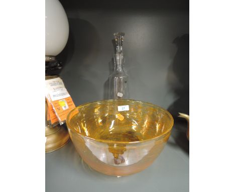 An amber glass bowl and tall decanter