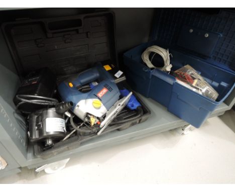 A selection of tools including a jig saw, blow lamp, chargers etc