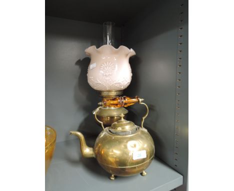 A brass oil lamp with glass shade and  a brass kettle