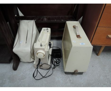 Two vintage electric sewing machines
