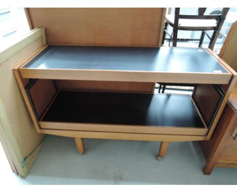 A vintage serving trolley, having butterfly mechanism
