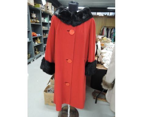 A vintage 1950s cherry red ladies wool swing style coat fashioned by Hockley of London, having fur trim to cuffs and collar a