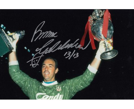 Football autographed BRUCE GROBBELAAR 12 x 8 photo : Col, depicting Liverpool goalkeeper BRUCE GROBBELAAR holding aloft the L