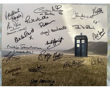 Doctor Who Tardis scene 14x11 inch colour photo signed by TWENTY actors who have appeared in the series, including Caroline M