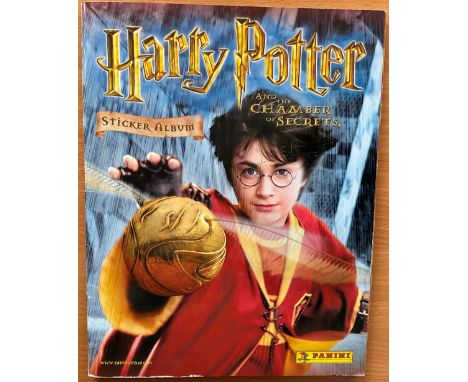 Harry Potter Cast, James and Oliver Phelps signed complete sticker album. This Chamber of Secrets sticker album is complete b