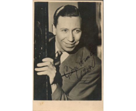 English Actor George Formby OBE Signed 5x3 Vintage Black and White Photo. Signed in blue ink in 1944. George Formby, OBE, bor