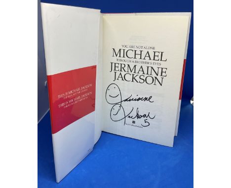 Singer Jermaine Jackson signed hardback book titled You Are Not Alone Michael Through a Brothers Eyes signature on the inside