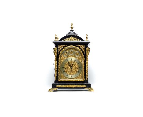 A large and impressive Victorian ebonised and gilt metal mounted quarter chiming table/bracket clock, the arched gilt brass d