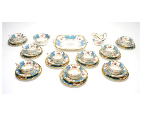 A Coalport 'Batwing' tea service, circa 1900, printed and painted with flowers on a turquoise blue ground, comprising: nine c