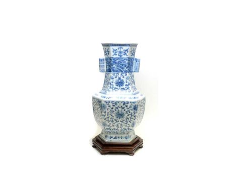 A Chinese blue and white arrow form vase, 20th century, decorated with flowers and scrolling foliage, double tube handles, Yo