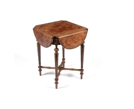 An attractive French marquetry and walnut drop-leaf centre table c1900,  the shaped and hinged four-leaf top with inlaid flor