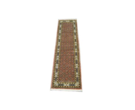 A Bidjar runner, with repeat roundel design, 293 x 83cms.
