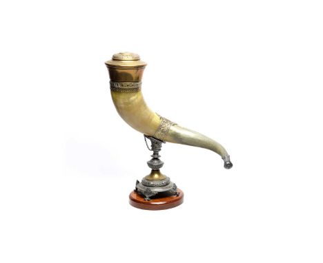 An early 20th Century horn table snuff, the large horn with brass cover and mounts having scrolling leaf decoration (missing 