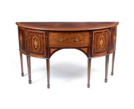 Robson &amp; Sons, Newcastle: A fine quality Edwardian inlaid mahogany and satinwood banded demi-lune sideboard, the central 