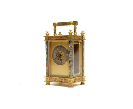 A late 19th Century French brass and champleve mantel clock, Richard &amp; Co., Paris, the lacquered brass case with leaf scr