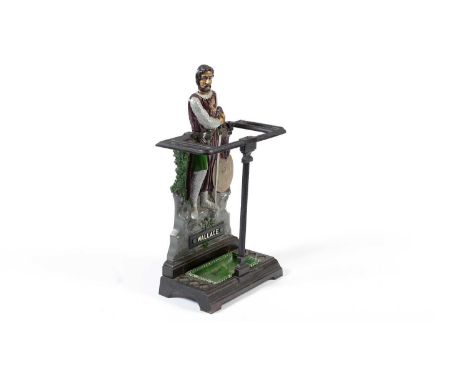 A cast iron William Wallace stick stand, late 19th/20th century, depicting Wallace in armour leaning on his sword, above a de
