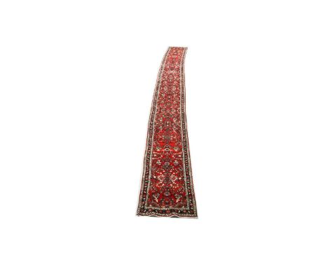 A very long Mehraban runner, with floral decoration, 1046 x 84cms.