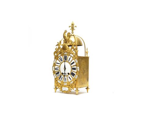 An ornate French brass hanging lantern clock, late 19th/20th Century, the ornate dial with raised enamelled roman numerals an