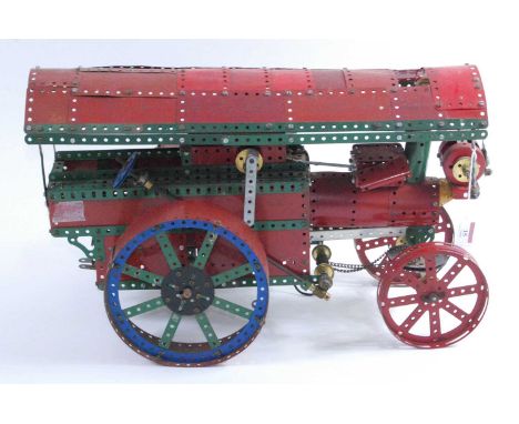 A Meccano home construction model of a Fowler Showman's engine, mainly constructed from red, green and base metal components,