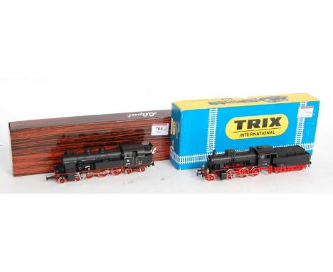 A Liliput Ref. 7801 H0 DB black 4-6-4 tank engine (NM-BNM) and sold with a Trix H0 black 2-6-0 engine and tender (NM-BNM)