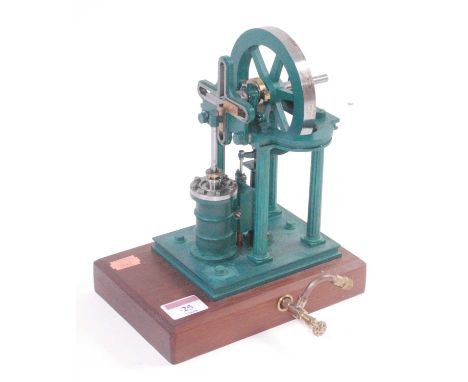 A very well-engineered possibly kit built model of a stationary vertical steam engine, comprising of single vertical cylinder