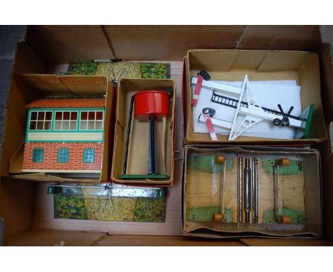 A large tray containing Hornby accessories; a 1933-41 E2 double track electric level crossing, appears to be a transitional v