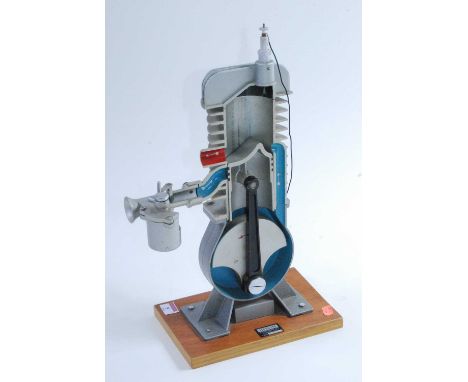 An Irwin &amp; Partners Ltd of Croydon cast cut-away demonstration model of a two-stroke engine, hand-operated example, with 