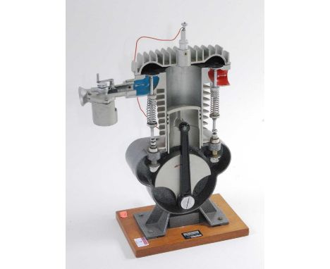 An Irwin &amp; Partners Ltd of Croydon cast alloy cut-away demonstration model of a four-stroke engine, type TG, No.188.54.30