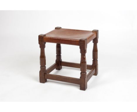 Robert Thompson of Kilburn (1876-1955) Mouseman stool oak on octagonal column supports, leather seat carved mouse 45.5cm high