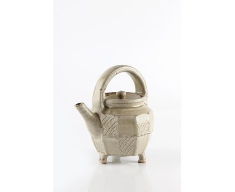Mike Dodd (b.1943) Teapot facetted sides and on three feet impressed potter's seal 19cm across.