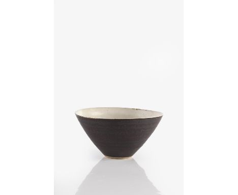Lucie Rie (1902-1995) Bowl the exterior with dark manganese glaze, the interior with white glaze impressed potter's seal 6.8c