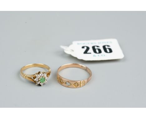 A possibly eighteen carat gold diamond and peridot cluster ring, 2.7 grms and an unmarked gold signet type ring, 2.4 grms