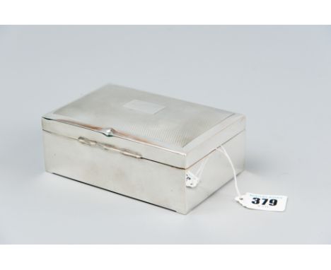 A plain oblong silver cigarette box with engine turned lid, Birmingham 1950