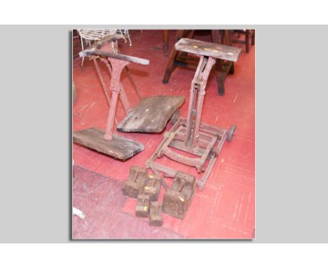 A set of iron based potato scales by Avery on iron wheels and five iron block weights