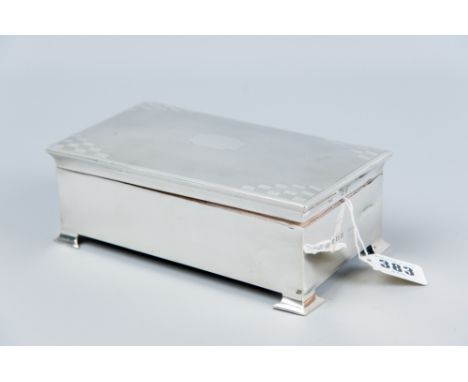 An oblong plain silver cigarette box with engine turned lid, Birmingham 1939