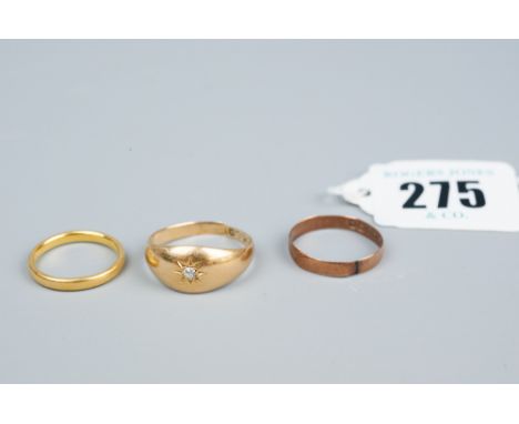 A twenty two carat gold narrow wedding band, 3.2 grms, a nine carat gold wedding band, 1 grm and an eighteen carat gold signe