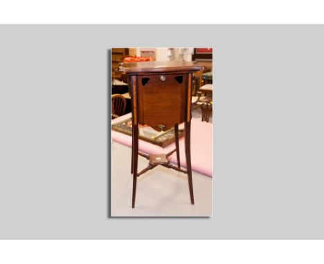 An Edwardian mahogany and crossbanded tea stand having a shaped square top with four drop down hinged sides, each having an i