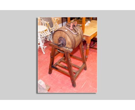 A compact barrel shaped end over end butter churn on a pitch pine stand by Hathaway