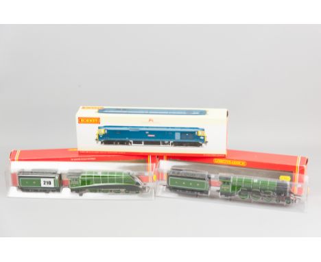 Two Hornby 00 gauge steam locomotives with tenders, R.313 LNER 4-6-2 loco titled 'Golden Eagle', a green and black livery LNE