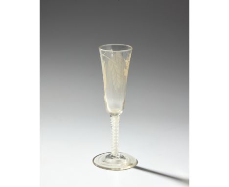 An ale glass, c.1755-80,&nbsp;the long drawn bowl engraved with a single hop bloom and two leaves and two barley ears, one wi