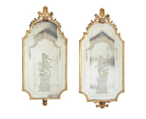 A pair of Italian giltwood girandoles, first half 19th century, of scrolled shaped rectangular form, one etched with Neptune 