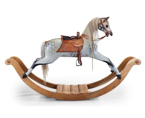 A hand-painted and carved rocking horse, by Stevenson Brothers, last quarter 20th century, with brass plaque inscribed Steven