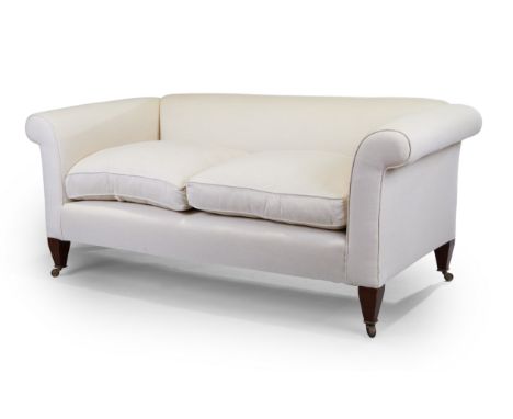 A modern sofa, by George Sherlock, recently upholstered in a stone linen fabric, on tapering mahogany feet to castors, 79cm h