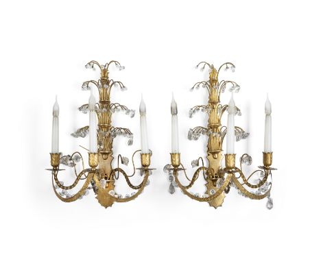 A pair of Swedish gilt-bronze and cut-glass three-light wall appliques, late 19th century and later elements, each shaped bac