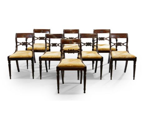 A set of eight Regency mahogany dining chairs, first quarter 19th century, including a pair of open armchairs, with ribbed so