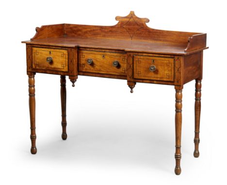 A Regency ebony strung mahogany inverted breakfront dressing table, first quarter 19th century, the gallery top above three d