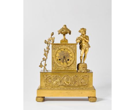 A French ormolu mantel clock, of Empire style, first half 19th century, the case surmounted with an urn with grape vines, fla