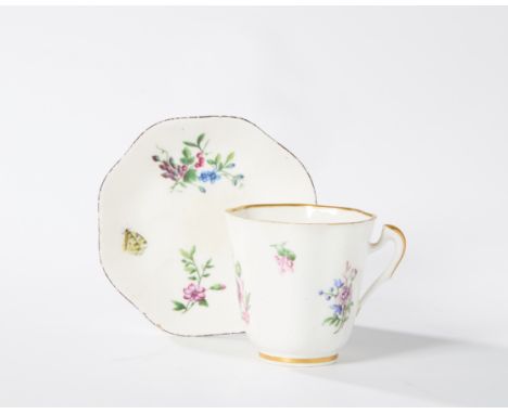 A Vincennes porcelain cup and a saucer (gobelet lizonné et soucoupe), c.1750, blue interlaced L cypher marks to both, the cup