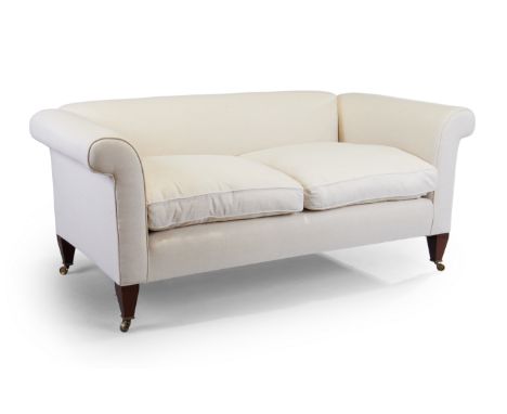 A modern sofa by George Sherlock, recently upholstered in a stone linen fabric, on tapering mahogany feet to castors, 79cm hi